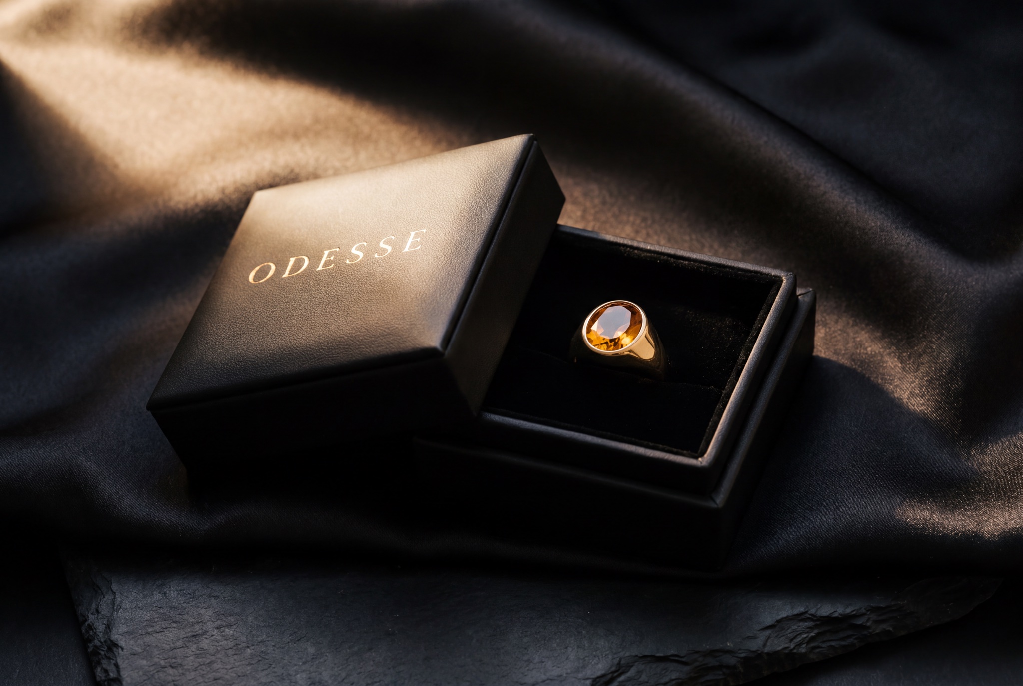 Odesse jewellery box in gold foil, the citrine signet ring inside